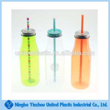 Plastic milk bottles with metal lids and straw