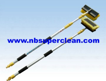 Cleaning water flow through telescopic car wash brush