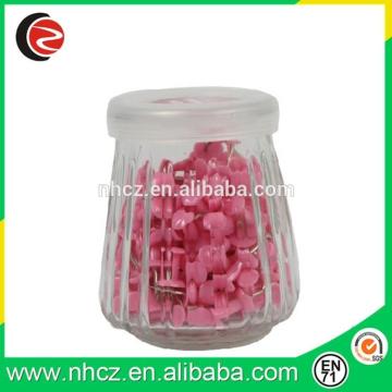 Pink push pin drawing pin in Glass Bottle