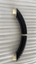 Carbon fiber wrapped carbon handle
