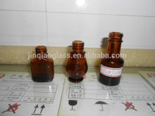 fancy small amber glass bottle