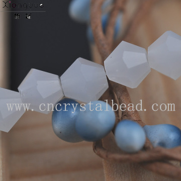 Machine faceted glass bicone bead
