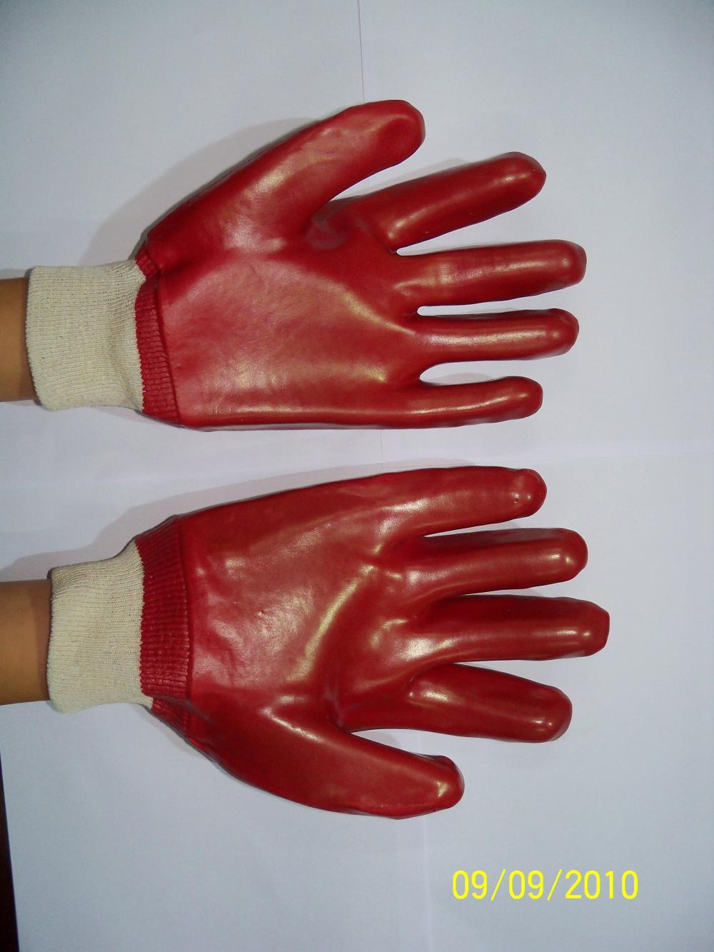 Guantes de PVC rojos solamente sumergidos con muñeca de punto