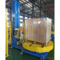 Automatic pallet wrapping system with rotating turntable