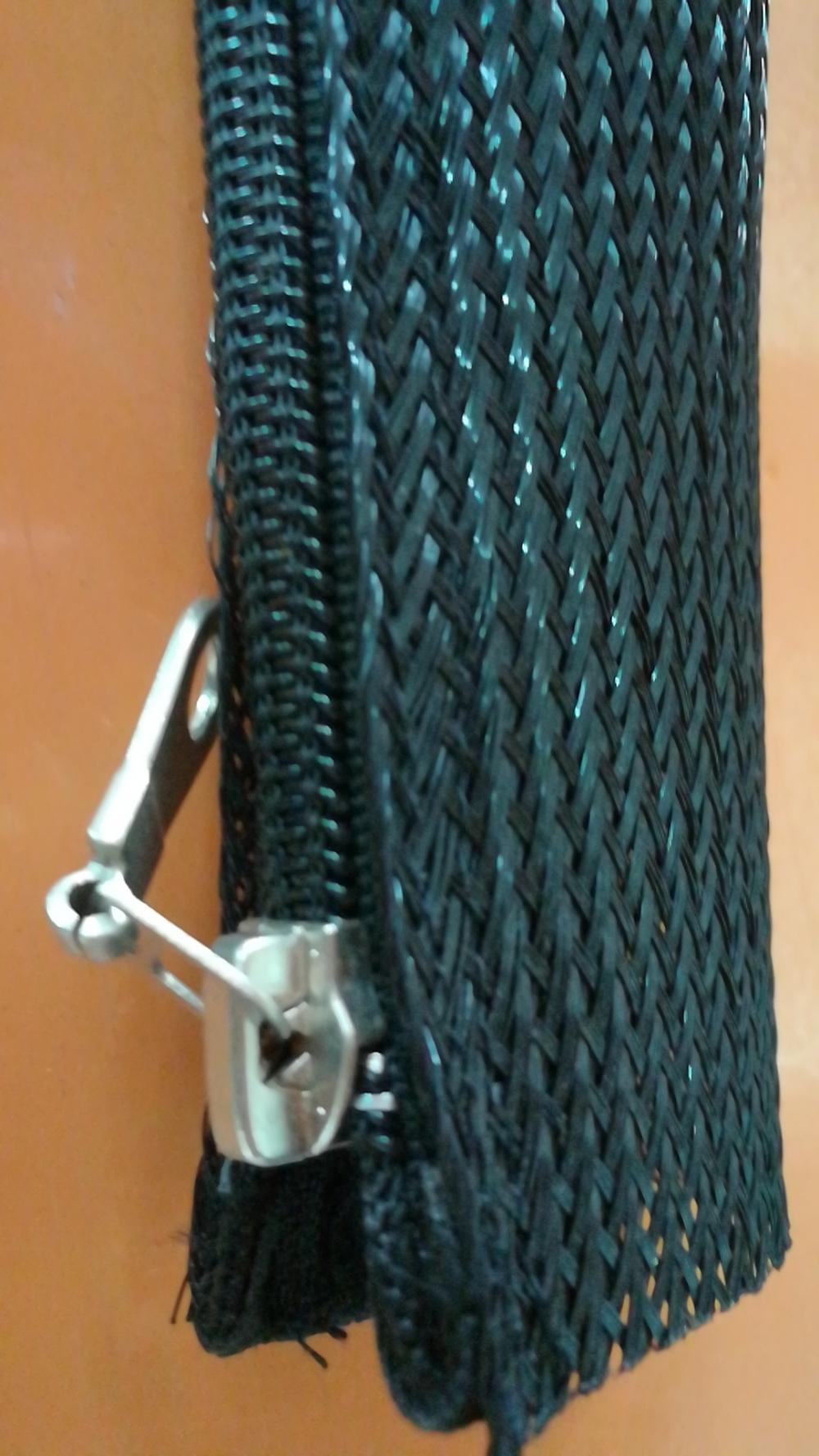 Black Zipper Sleeving Around Wire Hose