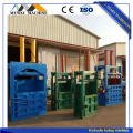 Vertical hydraulic baling machine for waste paper