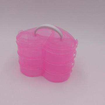 boîte de rangement en plastique rose en forme de cœur