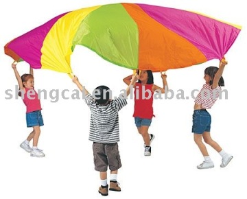children play rainbow parachute