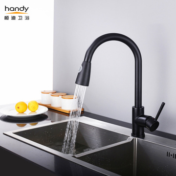 Black kitchen mixer tap with pull out spray
