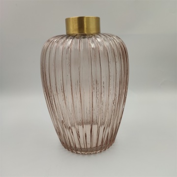 Tall glass vase with ribbed pattern