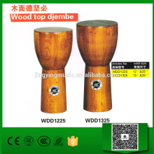 Wood top djembe