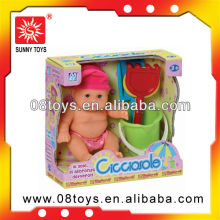 Toy baby with beach tools