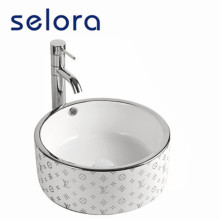 Керамическая посеребренная раковина для ванной комнаты в современном дизайне