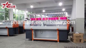 Sub roller intarsia sweater making machine