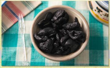 a Healthy Food with peeled Black Garlic