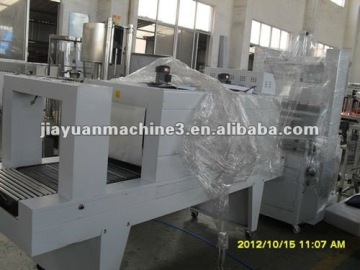 Semi automatic liquid bottle shrink wrapping machine