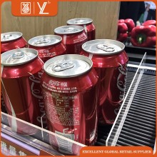 Multiple small plastic cylinders shelf faceing/ bev-sled shelf system