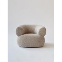 Moving Mountains Puffer chair by boucle fabric