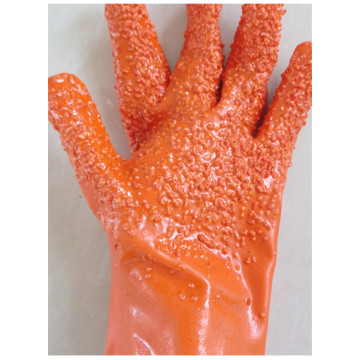 Guantes de pellet naranja para protección contra el frío.