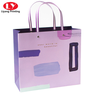 Clothing gift shopping paper bags with ribbon