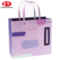 Clothing gift shopping paper bags with ribbon