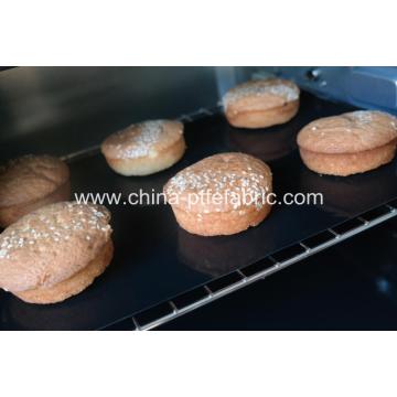 Reusable baking pan lined with silicone tray mat