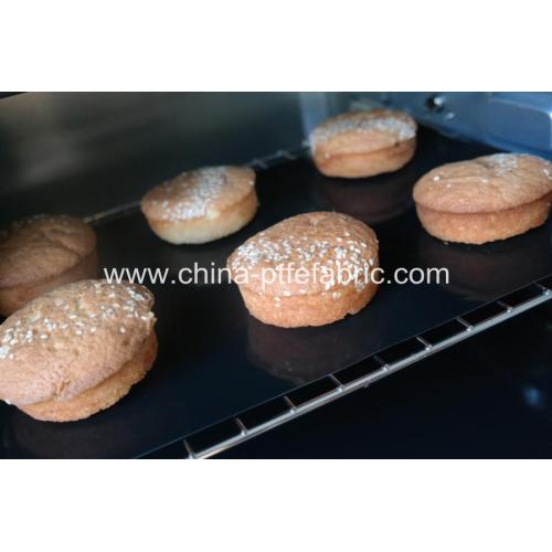 Reusable baking pan lined with silicone tray mat