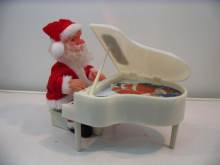 Musical Santa Claus plays Piano