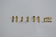 Metal stamping with gilt shrapnel