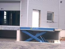 Dock lift and dock leveler
