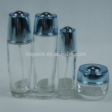 round glass lotion bottle and cream jar