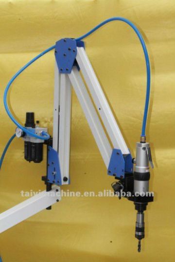 Pneumatic articulated arm tapping machine