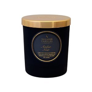 luxury soy candle in black ceramic jar with golden lid