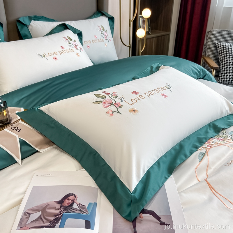 100コットンホテルのロゴ刺繍の寝具
