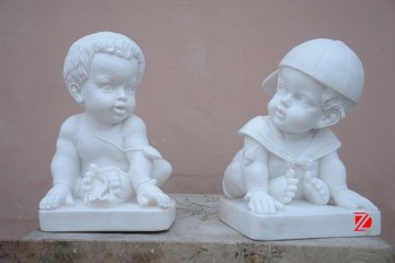 Funny little boy sculpture