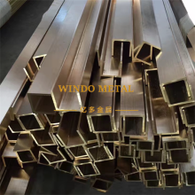 Extruded brass guide rails for industrial equipment