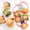 Großhandel Harz Cartoon Baby Girl Kopf Pferdeschwanz Halter Elastic Hair Tie Seilringe Pigtail Holders Elastic Rubber Band Ring