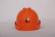Orange construction site safety helmet