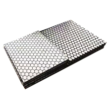 Anti-friction ceramic liners for mixing silo liners