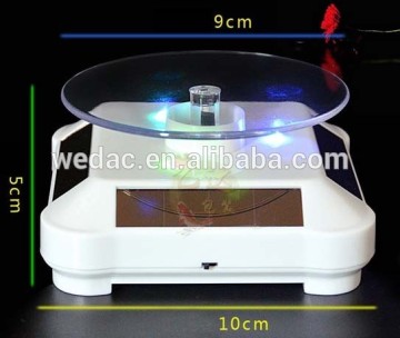 Solar energy driven rotating display table