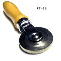 Tire repair tool corrugated rolling ball