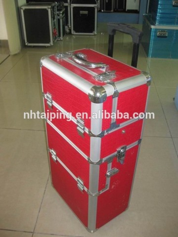 Red travel cosmetic organizer rolling cosmetic display train case