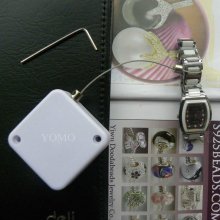 retractors and tethers for retail store displays