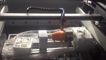 Rotary laser engraving machine for leather materials