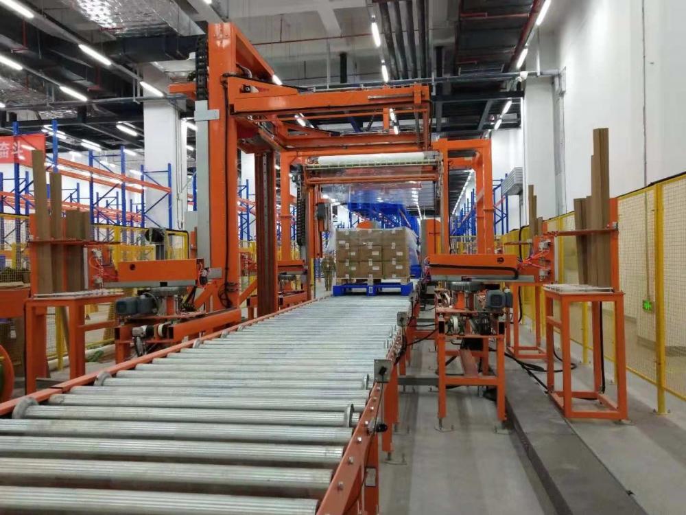 Auto pallet wrapping strapping corner application system