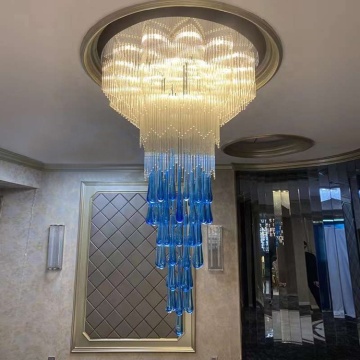 Custom Hotel Lobby Lighting: Staircase Chandelier and Sales Desk Lamps