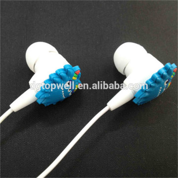 Cool design monster shape earphone with custom molded soft pvc charm