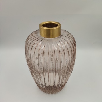 Tall glass vase with ribbed pattern