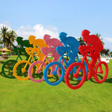 Abstract fiberglass resin bicycle riding sculpture