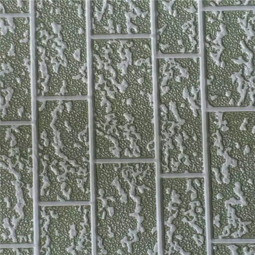 Insulated external embossed metal wall cladding